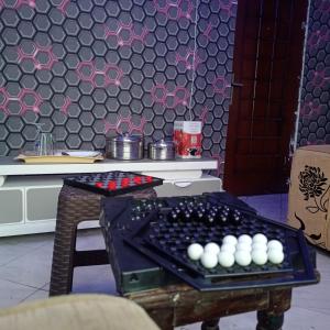 a room with a table with a board with balls on it at Kentania Hotel & Spa, Nakuru - Kenya in Nakuru