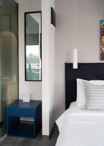 Postel nebo postele na pokoji v ubytování Olvia Suites