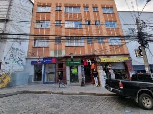 a truck parked in front of a building at Hotel Express in La Paz