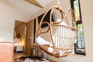 a wicker basket hanging from a wall in a living room at Gingerbread Lodge in Torquay