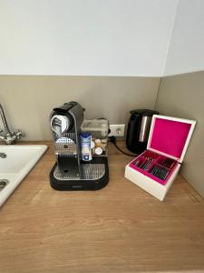 a kitchen counter with a coffee maker and a toaster at Ferienwohnung Waldseite in Bad Bentheim