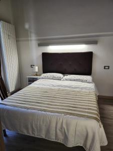 Posteľ alebo postele v izbe v ubytovaní Mansarde & Suite Maison 1706 Lago Orta