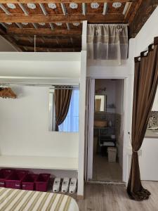 Posteľ alebo postele v izbe v ubytovaní Mansarde & Suite Maison 1706 Lago Orta