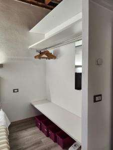 Posteľ alebo postele v izbe v ubytovaní Mansarde & Suite Maison 1706 Lago Orta