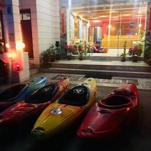 a group of kayaks lined up in front of a building at Three Jewels Boutique Hotel in Pokhara