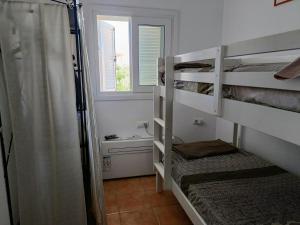 Un pat sau paturi într-o cameră la apartamento en el parque natural del cabo de gata