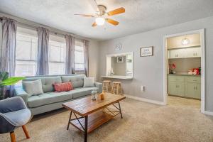 a living room with a couch and a table at Cozy & Comfy - Few blocks away from Plaza District in Oklahoma City