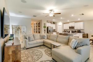 a living room with a couch and a kitchen at Ruskin Vacation Rental with Screened-In Porch! in Ruskin