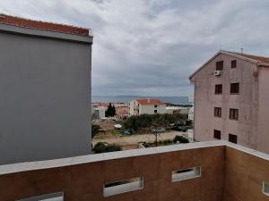 a view of a city from a building at Splendid Sea View Apartment Marko in Novalja