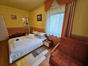 Postel nebo postele na pokoji v ubytování Abigél 2 Vendégház