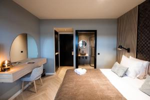Postel nebo postele na pokoji v ubytování Veluwe Hotel De Beyaerd
