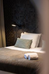 Postel nebo postele na pokoji v ubytování Veluwe Hotel De Beyaerd