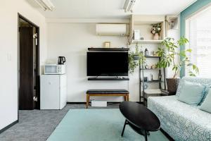 TV i/ili multimedijalni sistem u objektu さくらイン駅前癒やし空間
