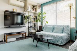 TV i/ili multimedijalni sistem u objektu さくらイン駅前癒やし空間