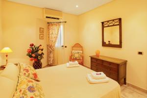 A bed or beds in a room at Vcv Bungalow Belda
