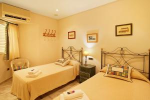 A bed or beds in a room at Vcv Bungalow Belda