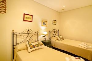 A bed or beds in a room at Vcv Bungalow Belda