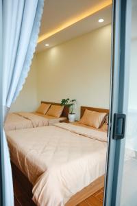 Postel nebo postele na pokoji v ubytování Anita homestay Dalat