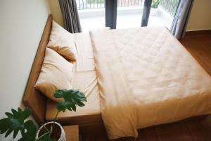 Postel nebo postele na pokoji v ubytování Anita homestay Dalat