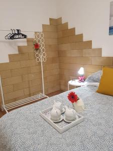 Posteľ alebo postele v izbe v ubytovaní La dimora di Don Vito - Appartamento confortevole