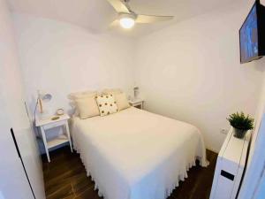 Ένα ή περισσότερα κρεβάτια σε δωμάτιο στο Apartamento al lado del Mar. Recién reformado.