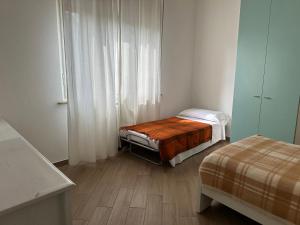 A bed or beds in a room at Appartamento via centro