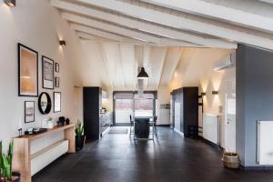 a large hallway with a kitchen and a living room at Inalia Modern House in Lefkimmi