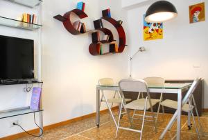 TV a/nebo společenská místnost v ubytování San Marzano Apartment
