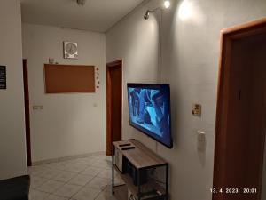 a living room with a flat screen tv on a wall at Impact House Split in Split