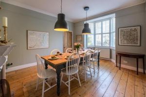 a dining room with a table and chairs at Hillcrest, Aldeburgh in Aldeburgh
