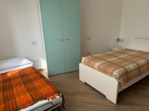 A bed or beds in a room at Appartamento via centro