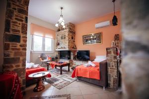 a bedroom with a bed and a fireplace at DAFNI'S HOME in Volos