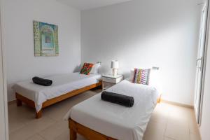 Posteľ alebo postele v izbe v ubytovaní Villa Roberto Ibiza