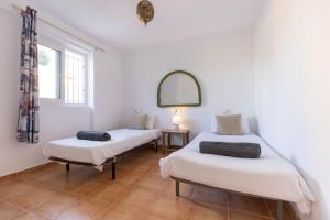 Posteľ alebo postele v izbe v ubytovaní Villa Roberto Ibiza