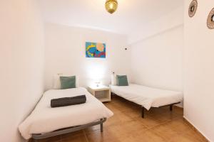 Posteľ alebo postele v izbe v ubytovaní Villa Roberto Ibiza