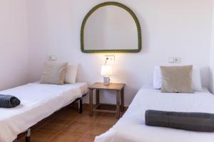 Posteľ alebo postele v izbe v ubytovaní Villa Roberto Ibiza