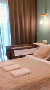 two beds in a room with two mattresses at Green Terrace Family Apartment in Wrocław