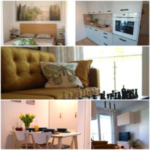 a kitchen and a living room with a couch and a table at Apartament Garden AiR in Sztutowo