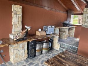 a kitchen with a stone counter with a stove at Apartmány u Dlouhána in Kadaň