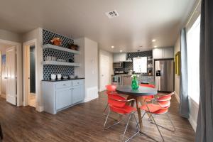 a kitchen with a table and chairs in a kitchen at Plaza Pad II-Near Plaza District in Oklahoma City