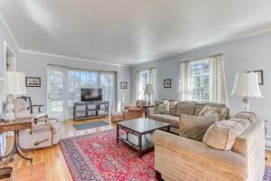 a living room with a couch and a table at Seaside Governor's House Vacation Rental in Seaside