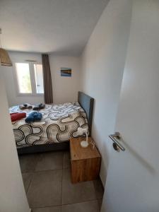 Postel nebo postele na pokoji v ubytování Apt 91, T2 à LECCI avec piscines, proche plage
