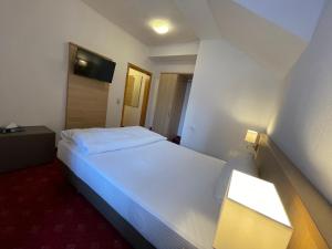 Letto o letti in una camera di Hafner Hotel Apartment Self Check-In Anytime