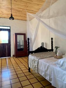 Postel nebo postele na pokoji v ubytování Rancho Saman