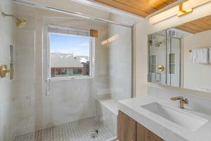 a bathroom with a shower and a sink and a mirror at West Willow 5 in Telluride +7 photos