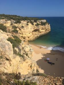 an aerial view of a beach with people and the ocean at 233 Casa Galo Verde Apartments in Porches