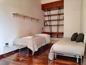 Posteľ alebo postele v izbe v ubytovaní Ospitaci Appartamenti San Salvatore