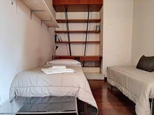 Posteľ alebo postele v izbe v ubytovaní Ospitaci Appartamenti San Salvatore