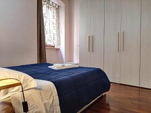 Posteľ alebo postele v izbe v ubytovaní Ospitaci Appartamenti San Salvatore