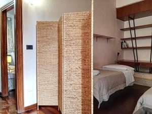 Posteľ alebo postele v izbe v ubytovaní Ospitaci Appartamenti San Salvatore